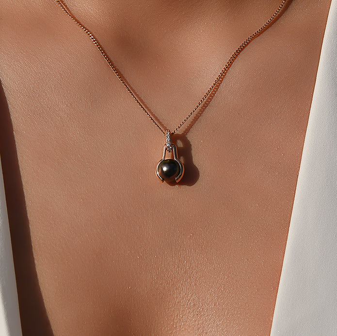 Pendant Earth is Round, yellow gold 18k, diamonds and dark pearls, with 5 additional fine stones, without chain